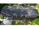 An aerial shot showing the home's roof, covered parking, and front yard at 109 Edgewood Dr, Louisburg, NC 27549