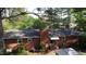 Brick home with backyard, patio, and landscaping under mature trees at 109 Edgewood Dr, Louisburg, NC 27549