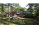 Overhead view showcasing the brick home and backyard with well-manicured lawn at 109 Edgewood Dr, Louisburg, NC 27549