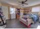 Inviting bedroom featuring a cozy sitting area, a ceiling fan, and natural light at 109 Edgewood Dr, Louisburg, NC 27549