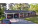 Well-maintained brick home featuring a convenient carport and a classic design at 109 Edgewood Dr, Louisburg, NC 27549