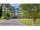 Charming single-story brick home with a covered carport and a spacious front yard at 109 Edgewood Dr, Louisburg, NC 27549