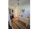 Bright hallway featuring a console table with decor and a patterned rug over wood flooring at 109 Edgewood Dr, Louisburg, NC 27549