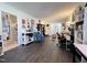 Bright and open living room with wood floors and a view into the kitchen area at 109 Edgewood Dr, Louisburg, NC 27549