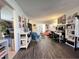 Open-concept living room showcasing wood floors and a view into the adjacent rooms at 109 Edgewood Dr, Louisburg, NC 27549