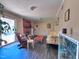 Comfortable living room with wood-look flooring, fireplace, and natural light from a sliding door at 109 Edgewood Dr, Louisburg, NC 27549