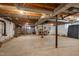 Unfinished basement space with exposed ductwork, ready for customization and storage at 1105 Hargrove St, Henderson, NC 27536
