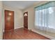 Foyer featuring hardwood floors and natural light at 1105 Hargrove St, Henderson, NC 27536
