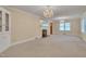 Spacious living room with carpet, a fireplace, and natural light at 1105 Hargrove St, Henderson, NC 27536