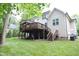 Large backyard with a spacious wooden deck for outdoor entertaining at 1108 Kalworth Rd, Wake Forest, NC 27587