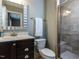 Bathroom featuring a vanity with storage, a toilet, and a glass door shower at 1108 Kalworth Rd, Wake Forest, NC 27587