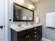 Bathroom featuring a dark wood vanity with a white countertop and double sinks at 1108 Kalworth Rd, Wake Forest, NC 27587