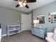 Sweet Bedroom design with a changing table, mirror, dresser, and sitting chair at 1108 Kalworth Rd, Wake Forest, NC 27587