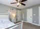 Comfortable bedroom with a ceiling fan, a window and an artistic floral paint feature at 1108 Kalworth Rd, Wake Forest, NC 27587
