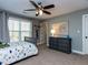 Comfortable bedroom features a ceiling fan, a window, and a world map wall decoration at 1108 Kalworth Rd, Wake Forest, NC 27587
