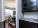 Dining room view from butler's pantry featuring hardwood floors and natural light at 1108 Kalworth Rd, Wake Forest, NC 27587