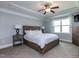 Primary bedroom offers ample natural light and a tray ceiling with a ceiling fan at 1108 Kalworth Rd, Wake Forest, NC 27587