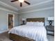 Main bedroom with large bed, ceiling fan, and en-suite bathroom at 1108 Kalworth Rd, Wake Forest, NC 27587