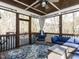Relaxing screened porch with wood ceiling, comfortable seating, and views of the backyard at 1108 Kalworth Rd, Wake Forest, NC 27587