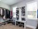 Organized walk-in closet offers ample storage with shelving and hanging space at 1108 Kalworth Rd, Wake Forest, NC 27587