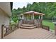 Large wood deck featuring a gazebo in a spacious backyard at 113 Gulf Drive Dr, Dunn, NC 28334
