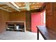 A large basement room with a counter, shelves, a door, and pegboard at 113 Gulf Drive Dr, Dunn, NC 28334