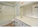 Bright bathroom with tub, shower, and large mirror above the vanity at 113 Gulf Drive Dr, Dunn, NC 28334