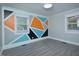 Unique bedroom with geometric wall art, hard floors, and natural light at 113 Gulf Drive Dr, Dunn, NC 28334