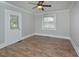Bright bedroom featuring neutral walls and flooring, a door and a window at 113 Gulf Drive Dr, Dunn, NC 28334