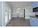 Bright dining room featuring hardwood floors, chandelier, and access to the backyard at 113 Gulf Drive Dr, Dunn, NC 28334