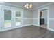 Cozy dining room featuring modern lighting and access to a deck and laundry room at 113 Gulf Drive Dr, Dunn, NC 28334