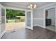 Open dining area leads to a deck with backyard views and a convenient laundry room at 113 Gulf Drive Dr, Dunn, NC 28334