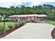Charming single-story home with a manicured front yard and a long driveway at 113 Gulf Drive Dr, Dunn, NC 28334