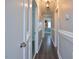 Long hallway with white trim and modern lighting at 113 Gulf Drive Dr, Dunn, NC 28334