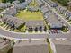 Aerial view of a neighborhood with beautiful townhomes, lush landscaping and manicured lawns at 1141 Amber Shadow Dr # 101, Durham, NC 27703