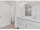 Bright bathroom with double vanity, quartz countertop, and glass-enclosed shower at 1141 Amber Shadow Dr # 101, Durham, NC 27703