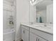 Bright bathroom with double sink vanity, white cabinets, quartz countertop, and shower/tub combo at 1141 Amber Shadow Dr # 101, Durham, NC 27703