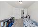 Bright bedroom with closet and bed, with space for playing and ample storage with shelving at 1141 Amber Shadow Dr # 101, Durham, NC 27703