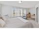 Comfortable bedroom featuring white walls, neutral décor, and plenty of natural light at 1141 Amber Shadow Dr # 101, Durham, NC 27703