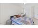 Bright bedroom with full sized bed and desk, featuring natural light from the window and a closet at 1141 Amber Shadow Dr # 101, Durham, NC 27703