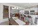 Open-concept dining area boasts modern lighting and breakfast bar with seating, perfect for entertaining at 1141 Amber Shadow Dr # 101, Durham, NC 27703