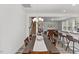 Bright dining area featuring stylish lighting, and seamlessly connects to living space and kitchen at 1141 Amber Shadow Dr # 101, Durham, NC 27703