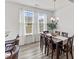Bright dining room with table, chairs and chandelier at 1141 Amber Shadow Dr # 101, Durham, NC 27703