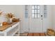 Bright entryway with decorative table and a textured glass door at 1141 Amber Shadow Dr # 101, Durham, NC 27703