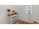 Bright entryway with decorative table and a textured glass door at 1141 Amber Shadow Dr # 101, Durham, NC 27703