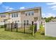 Well-maintained townhouse with manicured lawn and fenced backyard area at 1141 Amber Shadow Dr # 101, Durham, NC 27703