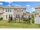 Two-story home with neutral siding, well-maintained lawn, and fenced backyard at 1141 Amber Shadow Dr # 101, Durham, NC 27703