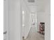 Hallway is bright and open, leading to bedrooms, and office with natural light at 1141 Amber Shadow Dr # 101, Durham, NC 27703