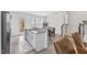 Modern kitchen and dining area with stainless steel appliances and breakfast bar at 1141 Amber Shadow Dr # 101, Durham, NC 27703
