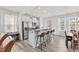 Bright kitchen with white cabinets, stainless steel appliances, and a kitchen island at 1141 Amber Shadow Dr # 101, Durham, NC 27703